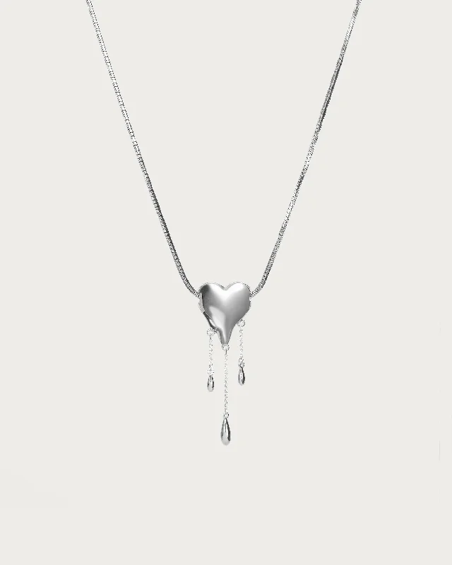 custom engraved nameplate necklace-Venom’s Golden Drip Heart Necklace in Silver